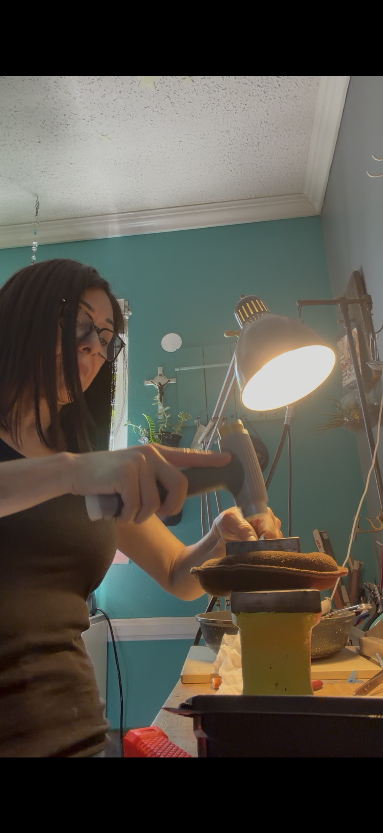 Holding a jewelry hammer